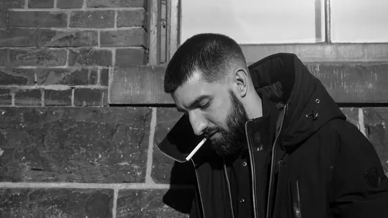 Portrait of Davide Mastracci smoking a cigarette